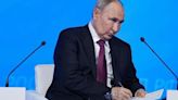 Putin urges restraint in state seizure of assets