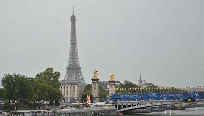 Paris Olympics: Teams sail down Seine in rain-soaked opening ceremony