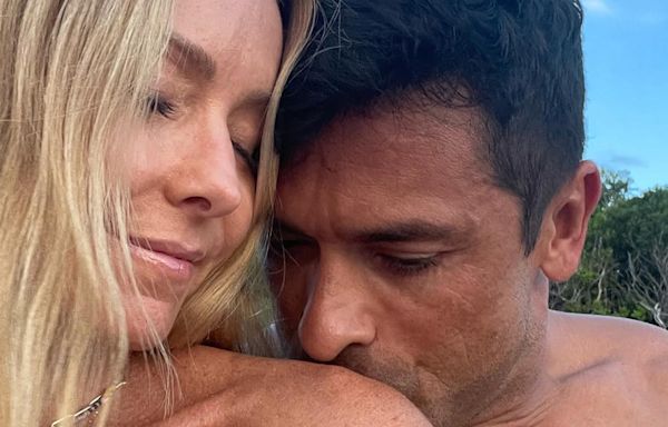 Shirtless Mark Consuelos kisses Kelly Ripa’s bare shoulder in beach pic