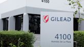 Gilead posts quarterly loss, revenue rises 5%