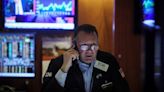 Wall Street ends lower as investors digest economic data