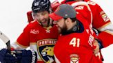 ...Florida Panthers players Kevin Stenlund Anthony Stolarz and Kyle Okposo celebrates after their team's win against the New York Rangers in Game 6 during...