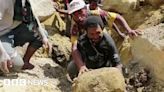 Papua New Guinea: Locals scramble to search deadly landslide by hand