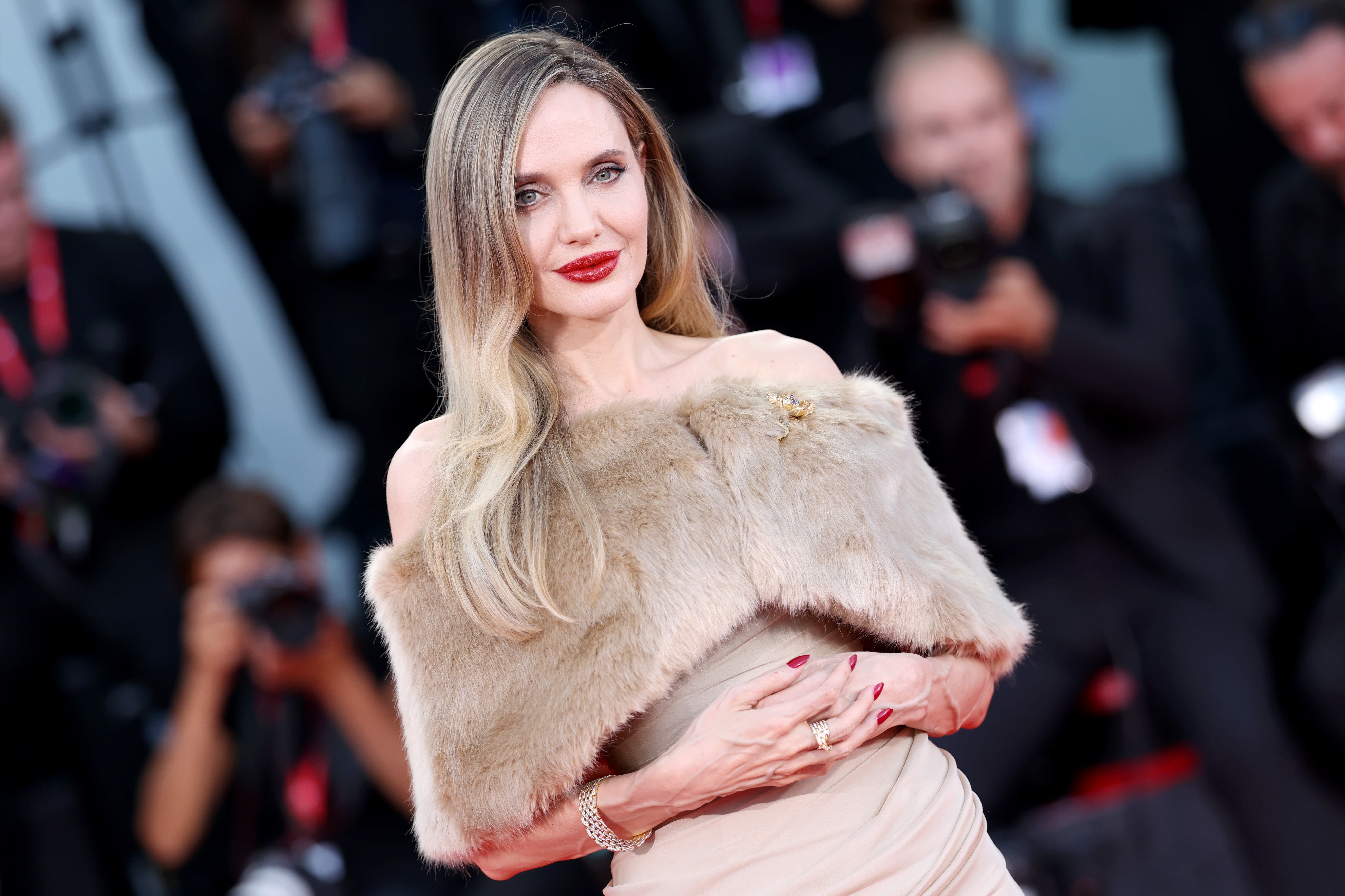 Angelina Jolie Looks Unrecognizable With Larger-Than-Life Disco Curls