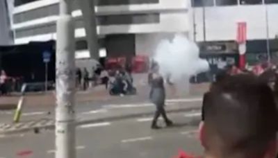 Watch as football fan loses fingers after setting off flare outside stadium