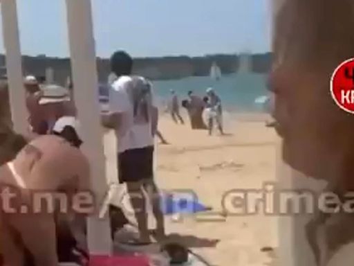 Ukrainian Atacms blows up over Crimean beach forcing sunbathers to flee as Russia claims five killed