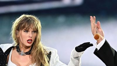 Travis Kelce Joins Taylor Swift Onstage for Surprise Appearance at Eras Tour Show - E! Online