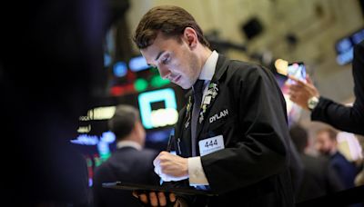 Stocks edge up, dollar down as PPI, Powell comments digested