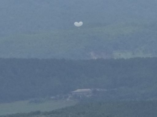 Trash dropped by a North Korean balloon falls on South Korea’s presidential compound