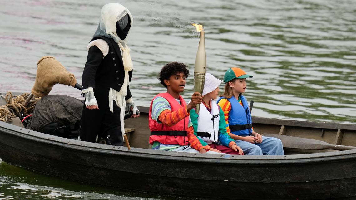 Opening Ceremony: Who is the hooded character with the Olympic torch?