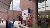 Unveiling Law Enforcement Center sign