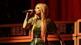 Avril Lavigne is 'serving looks' in new pics wearing black and orange hoodie: 'Icon'