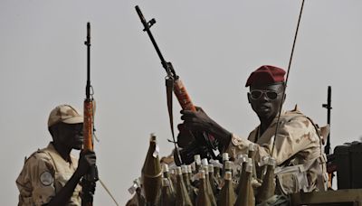Looting and fighting reported in a central Sudan city as paramilitary group attacks military troops