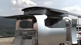 Airstream and Porsche have unveiled a sleek and modern concept RV that can fit inside a garage — see inside