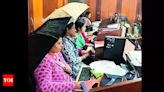 Umbrellas to rescue at leaky Haveri government office in Karnataka | Bengaluru News - Times of India