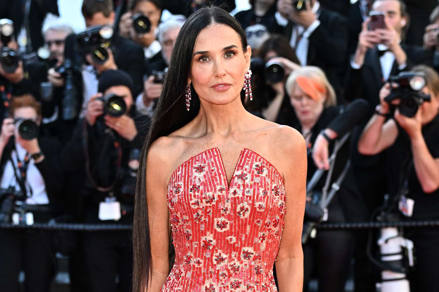 Demi Moore Makes Her Mark on the Cannes Red Carpet in Red-Hot Gown and Waist-Length Hair