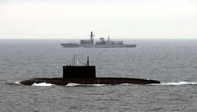 Royal Navy warships shadow Russian submarine in the Channel as four Kremlin vessels enter UK waters