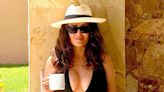 Salma Hayek Casually Sips Her Coffee in a Plunging One-Piece Swimsuit and Towering Platform Heels