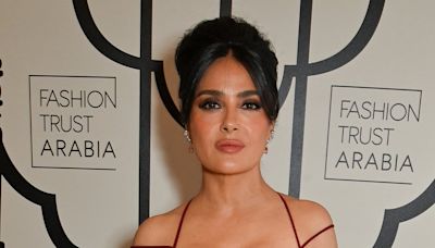 Salma Hayek, 57, puts on a very busty display in a plunging red dress