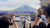 To fend off tourists, a town in Japan is building a big screen blocking the view of Mount Fuji