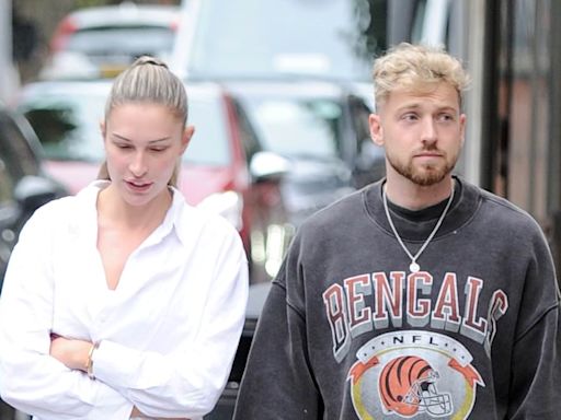 Zara McDermott looks downcast on a stroll with boyfriend Sam Thompson