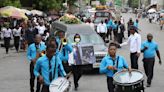 Hundreds mourn gang killings of a Haitian mission director and a young American couple