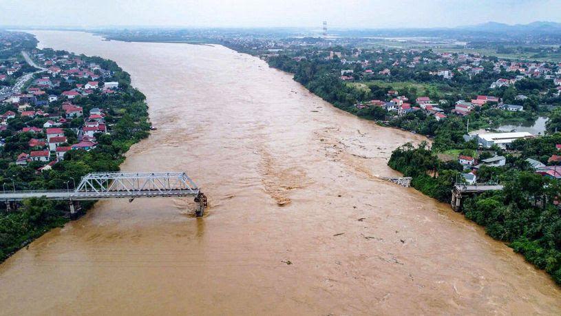 Cars plunge into river as super typhoon destroys Vietnam bridge