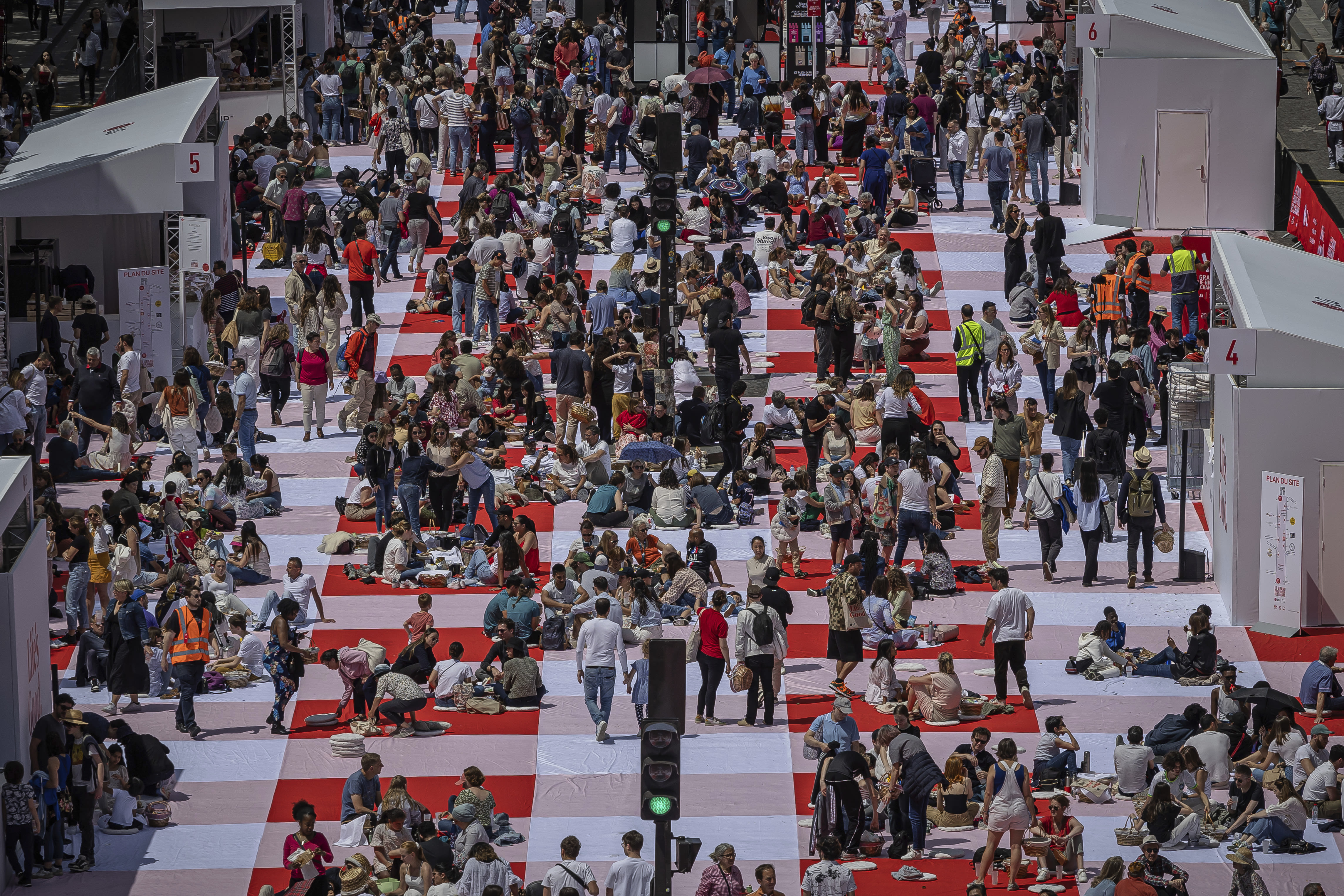 Paris' traffic-clogged Champs-Elysees turned into a mass picnic blanket for an unusual meal