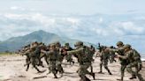 Australian, US, Filipino forces practice retaking an island in a drill along the South China Sea