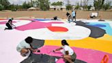 Volunteers paint mural in Fresno neighborhood as part of revitalization. Take a look