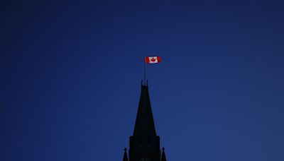 Different schools of thought on why Canada drapes itself with red and white