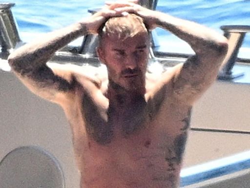 David Beckham gives himself a good hose down in his tighty whities on a yacht