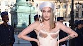 Cara Delevingne Laces Up in a Satin Minidress with a Horn-Like Bust