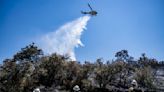As heat wave scorches California, firefighters make headway against wildfires
