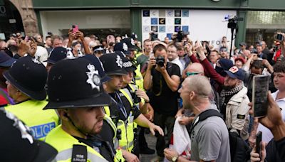 UK riots live: Far-right mob gather outside Rotherham migrant hotel as police brace for more violence