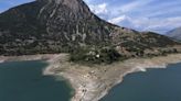 Ruins of a long-sunken Greek village emerge as drought saps a vital reservoir