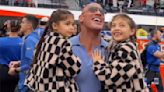 Dwayne Johnson Holds Daughters in His Arms While Watching Wife Lauren Hashian Sing the National Anthem