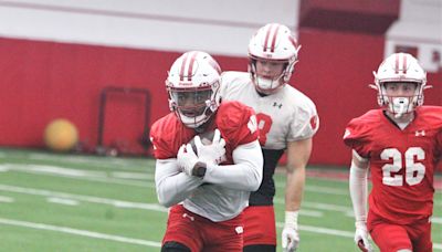 New Wisconsin receivers coach Kenny Guiton spent hours watching video to learn about his players