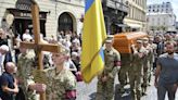 Thousands in Ukraine attend funeral of former lawmaker and critic of Russia who was killed in Lviv