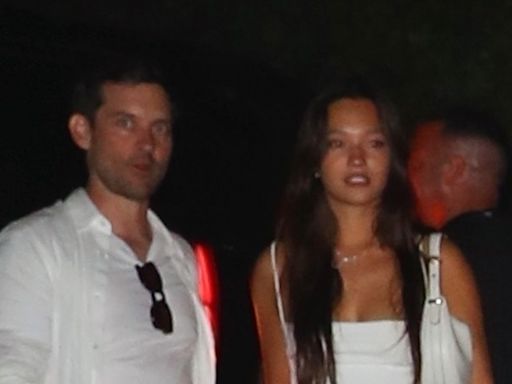 Tobey Maguire spotted with 20-year-old actress on his arm at Fourth of July bash