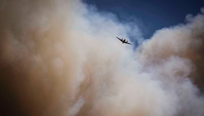 Rain could help fight growing New Mexico blazes, but floods and wind a danger