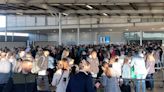 Photos show travel chaos at one of the busiest airports south of the equator with lines snaking hundreds of meters after technical issues and heavy fog