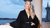 Kate Hudson Pairs a Sexy Plunging Black Dress With a Bold Red Lip at Max Mara Show