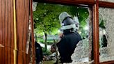 Smashed windows and piled furniture left after occupation of Hamilton Hall