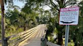 Flagler officials warn public after photo shows kids feeding alligator in Wadsworth Park