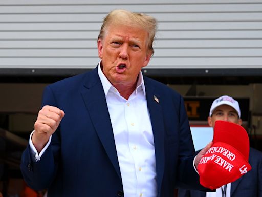 Donald Trump waves to crowd and visits McLaren garage at F1 Miami Grand Prix