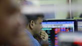 Indian shares end flat in volatile session ahead of inflation data