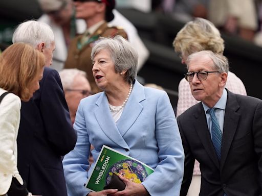 Theresa May and Romeo Beckham among spectators on drizzly day three of Wimbledon