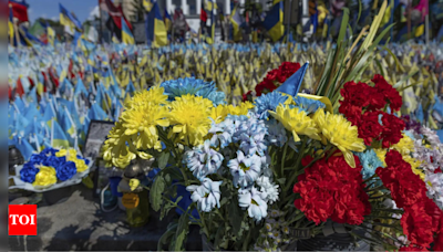 A precious moment in time of war: Flowers for a wife and daughter coming home to Ukraine - Times of India