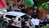 'Shrill idiots' waving Palestinian flags grapple rush car of MP Jacob Rees-Mogg